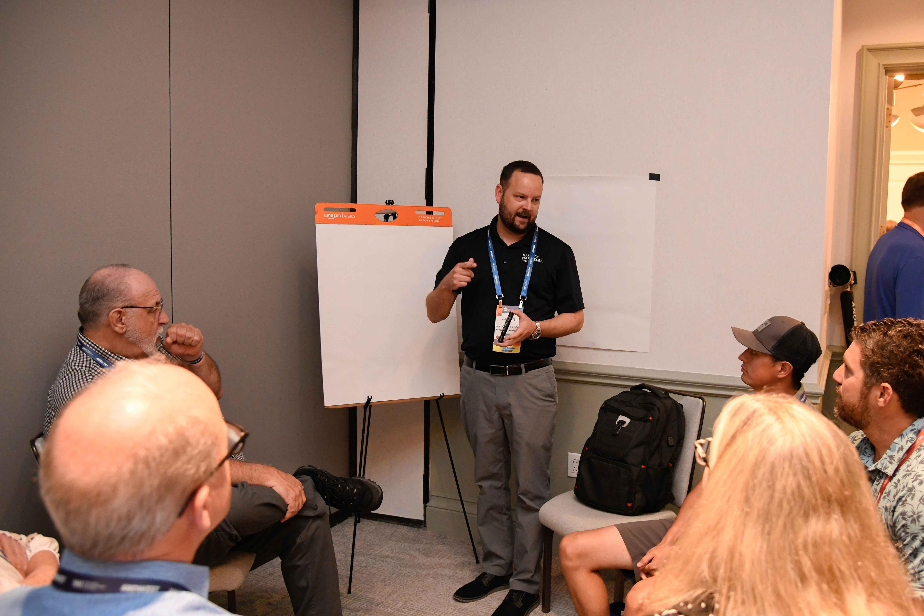 Retailers participate in a hackathon educational breakout session.